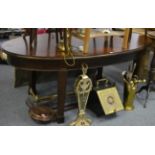 An oval mahogany dining table