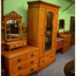 Four pieces of early 20th century bedroom furniture comprising two dressing tables, a mirror fronted