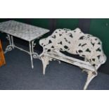 A Coalbrookdale style aluminum fern pattern garden bench and a white painted rectangular outdoor