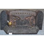 A cast iron fire grate, circa 1887, cast and pierced with a ship flanked by the royal supporters and