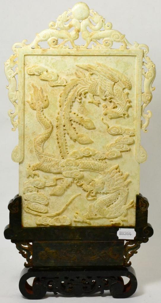 A Chinese carved stone table screen decorated in relief with a dragon and a phoenix, calligraphy