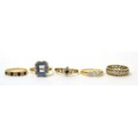 A 9 carat gold blue topaz ring, finger size J1/2 and four other 9 carat gold gem set rings (5)