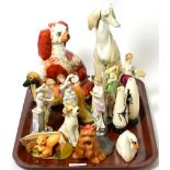 A collection of ceramics including, a 19th century Staffordshire spaniel, two Beswick dogs, a