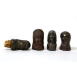Four stoneware 'character' bottle stoppers