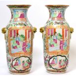 A pair of Chinese Canton porcelain vases Each with rubbing and light paint scratches, one vase