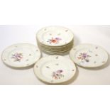 A group of 19th century hand painted side plates decorated with flowers, with underglaze blue