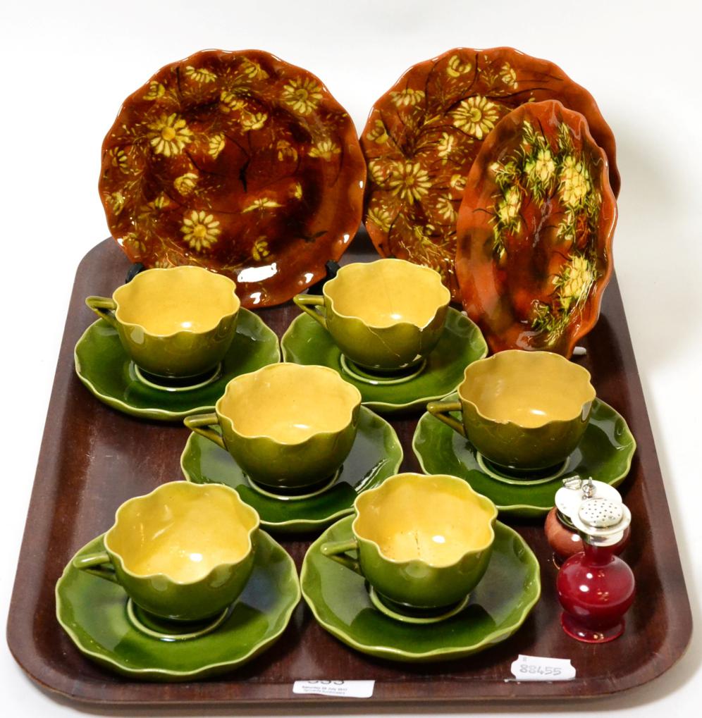 A small collection of Linthorpe pottery including six teacups and saucers, three plates, a mustard