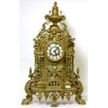 A large gilt metal mantel clock with German movement