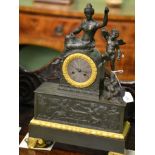 A French gilt metal striking mantel clock, case depicting a lady in robes with a winged cherubDial
