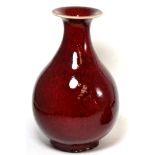 A sang de boeuf baluster vase34cm high, modern, generally in good condition.