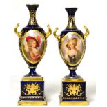A pair of Continental porcelain twin handled vases on stands, each painted with an oval miniature