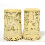 A pair of late 19th century Chinese pierced ivory twist vases Both appear in generally good