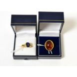 An 18ct gold iolite and diamond ring together with a 9ct gold amber set ring Iolite and diamond ring