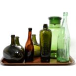 Six 18th/19th century glass bottles and a green jar and cover (a.f.)