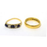 An 18ct gold band ring, size M1/2 and a sapphire and diamond ring (shank misshapen) (2)6.6g gross