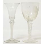 An opaque air twist stem wine glass with trumpet shaped bowl; and an air twist stem wine glass