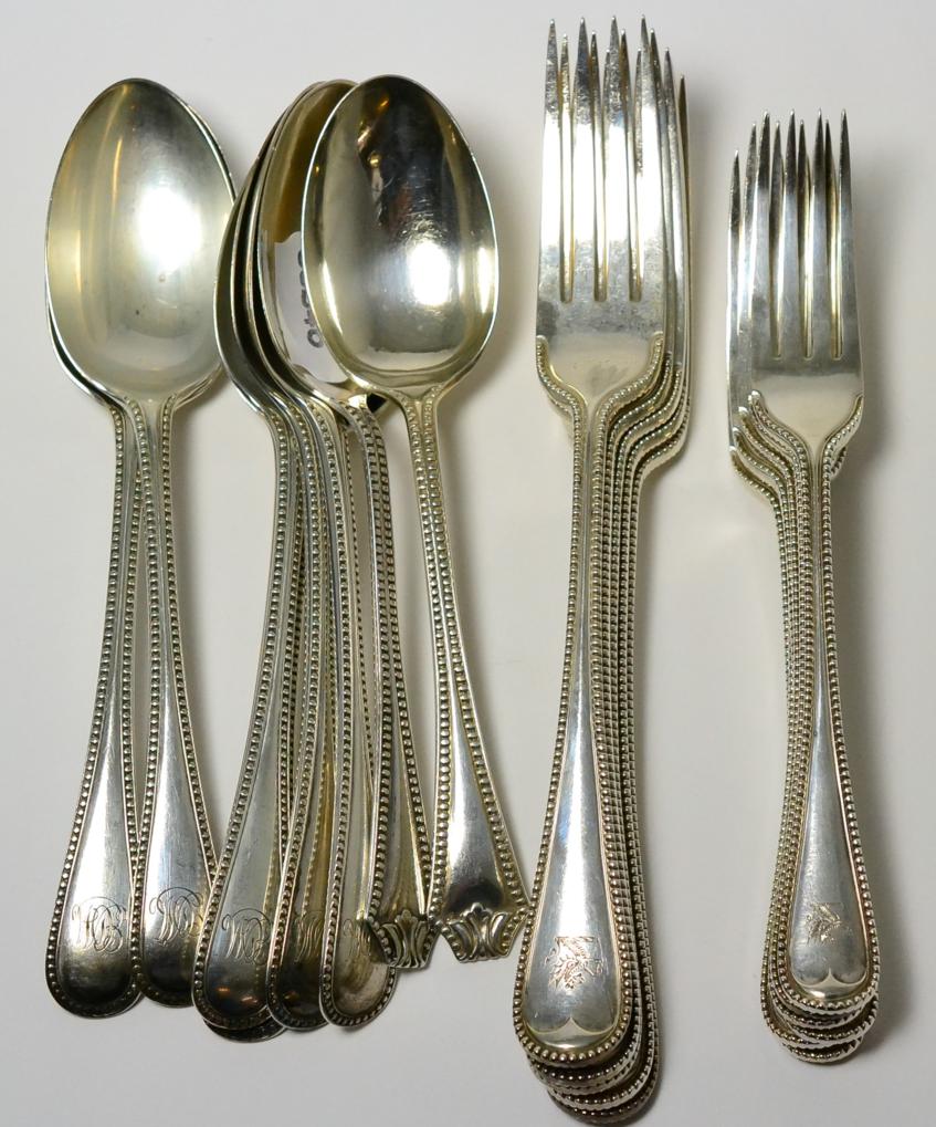 A 19th/20th century composite silver part service of beaded spoons and forks, including six