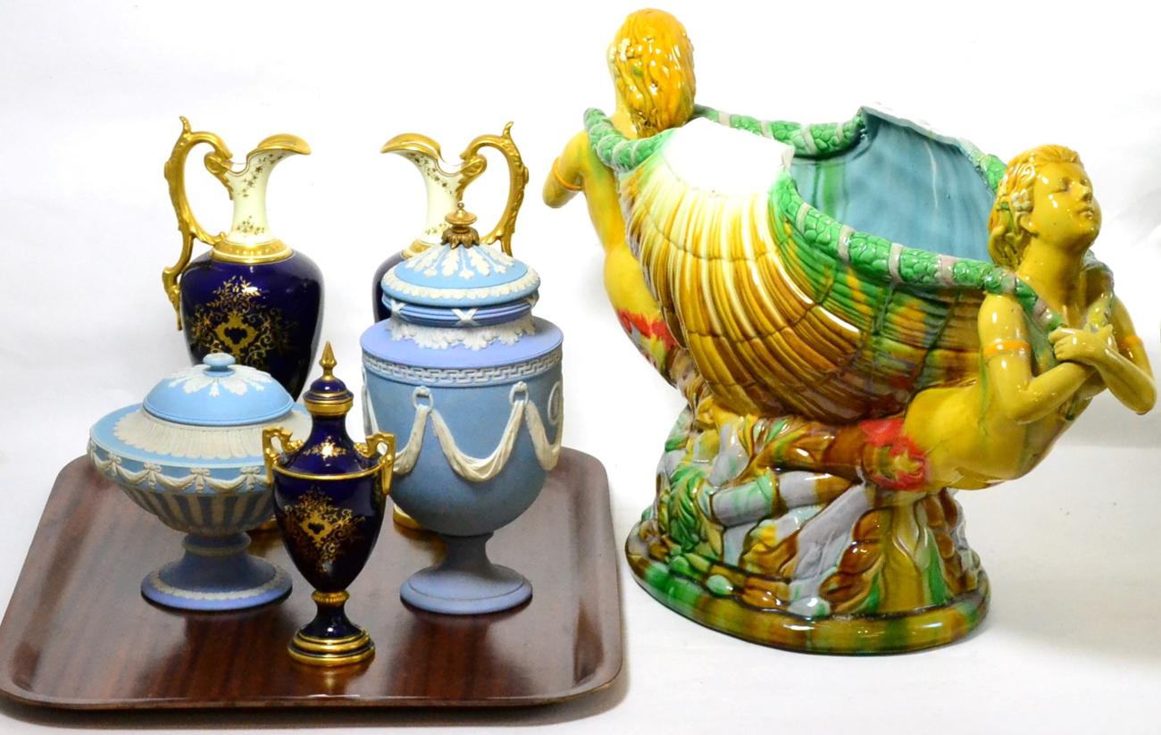 A Mintons style Majolica centrepiece together with a Wedgwood blue jasper vase and matched cover and