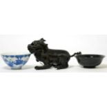 A group of Oriental items including; a bronze censer in the form of a Foo Dog; a spinach jade