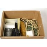 A box of collectables including a carved wooden dog form walking cane handle, watch and costume