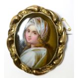 A Victorian portrait miniature on porcelain in a yellow metal mount