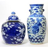 A Chinese porcelain blue and white vase with Buddhist lions amongst clouds; and a blue and white