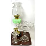 A Victorian oil lamp with green glass reservoir and etched glass shade, a glass lustre candlestick