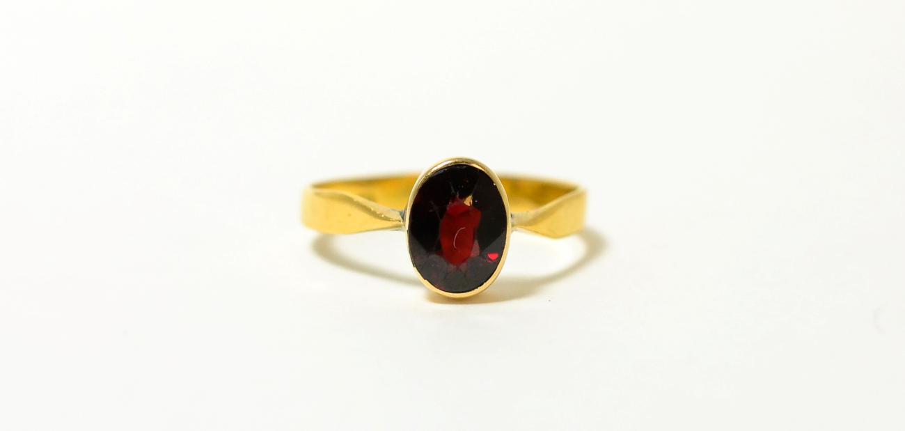 A 22ct garnet ring, finger size R1/23.2g