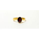 A 22ct garnet ring, finger size R1/23.2g