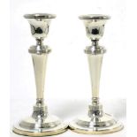 A pair of Georgian style silver candlesticks, Birmingham, 1912