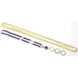 A 22ct gold band ring, size N1/2, an amethyst bead necklace, a simulated pearl necklace and two