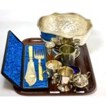 A silver mustard pot and salt, a set of plated stacking cups, a silver bud vase together with a pair