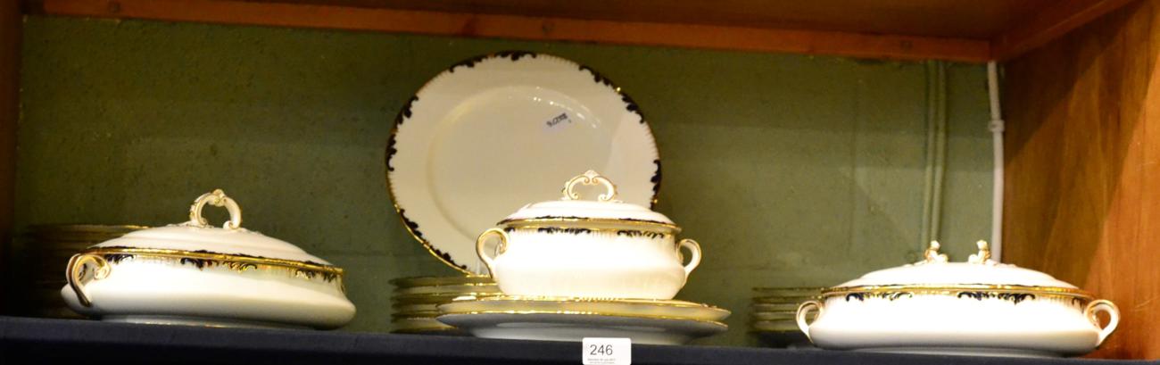 A Cauldon china part dinner service including dinner plates, side plates, soup bowl, tureens etc