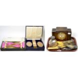A cased silver and pink enamel four piece brush set, a cased silver backed four piece gents brush
