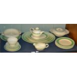 A large assortment of Clarice Cliff green band pattern wares, examples produced by Newport