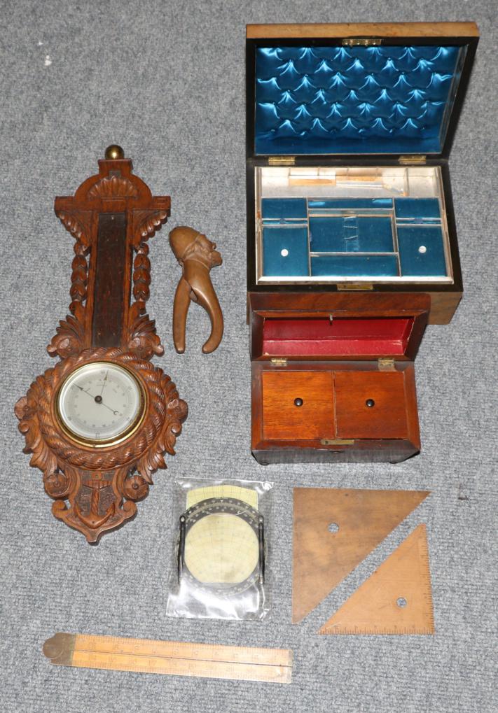 A carved oak barometer, rules, tea caddy, Victorian box etc