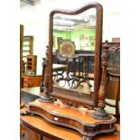 An intricately carved Victorian toilet mirror each upright carved with an initial