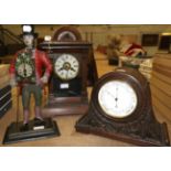 A reproduction figural mantel timepiece, a carved oak mantel aneroid barometer, a striking mantle