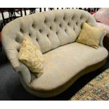 A mahogany framed button back sofa The legs turned tapering cylindrical section front legs, and