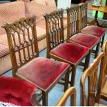A set of four Gothic dining chairs