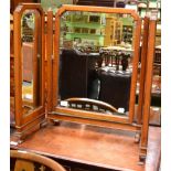 A triple section swing dressing table mirror, with bevelled glass