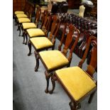 A set of eight Queen Anne style dining chairs with urn form splats