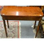 A 19th century mahogany fold over tea table