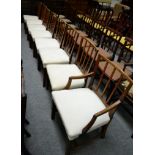 A set of eight George III oak dining chairs including one carver