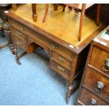 A leather inset mahogany ladies kneehole writing desk