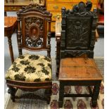 A carved mahogany hall chair together with a carved oak hall chair