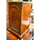 A 19th century walnut bedside cupboard with brass gallery