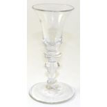 A Wine Glass, circa 1740, the bell shaped bowl with annular basal knop on a baluster stem and