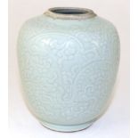 A Chinese Porcelain Jar, Jaijing reign mark, carved with dragons amongst lotus blossom, six