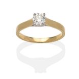 An 18 Carat Gold Diamond Solitaire Ring, a round brilliant cut diamond in a white claw setting, on a